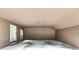 Attached carport area for two vehicles with finished ceiling, lighting, and two access doors at 402 Summit Ridge Ter, Lawrenceville, GA 30046