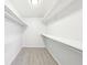 Walk-in closet with shelving for optimal storage and organization at 402 Summit Ridge Ter, Lawrenceville, GA 30046
