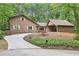 Charming two-story home featuring a private driveway and lush green landscaping at 402 Summit Ridge Ter, Lawrenceville, GA 30046