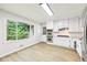 Bright kitchen features stainless steel appliances, granite countertops, and lots of natural light at 402 Summit Ridge Ter, Lawrenceville, GA 30046