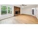 Cozy living room with brick fireplace and large window at 402 Summit Ridge Ter, Lawrenceville, GA 30046