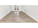 Spacious living room with hardwood floors and access to patio at 402 Summit Ridge Ter, Lawrenceville, GA 30046