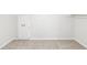 An organized and brightly lit room with a carpet and a closet at 402 Summit Ridge Ter, Lawrenceville, GA 30046
