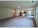 Large, open living space combining the living room, kitchen, and dining area, perfect for entertaining at 7797 Sudbury Cir, Covington, GA 30014