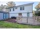 Backyard with a wooden deck, green grass, privacy fence, and house exterior view at 3412 Collier Nw Dr, Atlanta, GA 30331
