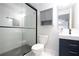 Modern bathroom featuring a glass-enclosed shower, stylish vanity, and sleek fixtures at 3412 Collier Nw Dr, Atlanta, GA 30331
