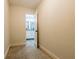Hallway view into a bathroom with patterned tile flooring, a double vanity and white cabinets at 3412 Collier Nw Dr, Atlanta, GA 30331