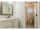Bathroom with marble countertop vanity and dark faucet, and a view into the shower at 3412 Collier Nw Dr, Atlanta, GA 30331