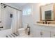 Well-lit bathroom features tile flooring, a shower-tub combination, and a granite vanity at 3412 Collier Nw Dr, Atlanta, GA 30331