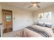 Bedroom with decoratively painted walls, a ceiling fan, and an en suite bathroom view at 3412 Collier Nw Dr, Atlanta, GA 30331