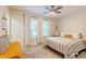 Bright bedroom featuring a ceiling fan, windows with natural light, and neutral decor and furnishings at 3412 Collier Nw Dr, Atlanta, GA 30331