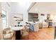 Dining area open to the updated kitchen boasting stainless steel appliances and open shelving at 3412 Collier Nw Dr, Atlanta, GA 30331