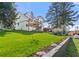 Beautifully landscaped front yard with lush green grass and colorful flower beds at 3412 Collier Nw Dr, Atlanta, GA 30331