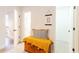 Hallway seating area with a decorative wooden chest with a cushion and bathroom view at 3412 Collier Nw Dr, Atlanta, GA 30331