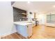Beautiful kitchen featuring modern appliances, sleek countertops, and stylish geometric backsplash at 3412 Collier Nw Dr, Atlanta, GA 30331