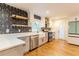 Modern kitchen with stainless steel appliances, quartz countertops, and stylish backsplash at 3412 Collier Nw Dr, Atlanta, GA 30331