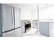 A well-equipped kitchenette features stainless steel appliances, granite countertops and stylish cabinetry at 3412 Collier Nw Dr, Atlanta, GA 30331