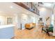 Open living space featuring hardwood floors, an upstairs loft and a glimpse into the kitchen at 3412 Collier Nw Dr, Atlanta, GA 30331