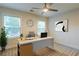 Office space with windows, a ceiling fan, a desk, a chair, and decorations at 3412 Collier Nw Dr, Atlanta, GA 30331