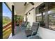 Relaxing covered porch with comfortable seating and view of the yard at 3412 Collier Nw Dr, Atlanta, GA 30331