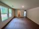 Bright bedroom with two large windows offering natural light at 7791 Sudbury Cir, Covington, GA 30014