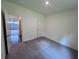 Clean bedroom with neutral carpeting, white walls, and ample natural light at 7791 Sudbury Cir, Covington, GA 30014