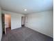 Bedroom with carpet, closet, and white door at 7791 Sudbury Cir, Covington, GA 30014