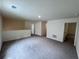 Spacious carpeted bonus room offering versatile space for entertainment or relaxation at 7791 Sudbury Cir, Covington, GA 30014