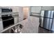 Kitchen with stainless steel appliances, granite countertops, and a pantry at 7791 Sudbury Cir, Covington, GA 30014