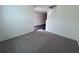 Living room area with neutral carpeting and white walls at 7791 Sudbury Cir, Covington, GA 30014