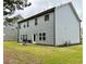 Well-kept backyard featuring gray siding, a grill, and a cozy patio space at 1452 Weatherbrook Cir, Lawrenceville, GA 30043