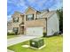 Attractive two-story home with brick accents, green lawn, and a convenient two-car garage at 1452 Weatherbrook Cir, Lawrenceville, GA 30043