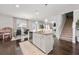 Bright, modern kitchen with a central island, stainless steel appliances, and hardwood floors at 1452 Weatherbrook Cir, Lawrenceville, GA 30043