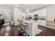 Stylish kitchen boasts a granite island with seating, white cabinets, and stainless steel appliances at 1452 Weatherbrook Cir, Lawrenceville, GA 30043