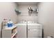 Laundry room features a washer and dryer with a shelf at 1452 Weatherbrook Cir, Lawrenceville, GA 30043