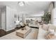 Bright living room with hardwood floors, white sofas, and a decorative fireplace, perfect for Gathering gatherings at 1452 Weatherbrook Cir, Lawrenceville, GA 30043