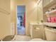 Bathroom showcasing a vanity, toilet, and doorway to another room at 2160 Dillard Xing, Tucker, GA 30084