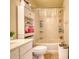 Functional bathroom with a shower-tub combination and storage shelves at 2160 Dillard Xing, Tucker, GA 30084