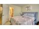 Bedroom with queen-size bed, doorway to a bathroom, and decor at 2160 Dillard Xing, Tucker, GA 30084