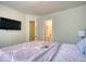 Bedroom featuring a television and doorway to an ensuite bathroom at 2160 Dillard Xing, Tucker, GA 30084