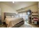 Bedroom featuring upholstered headboard, carpeted floor and modern decor at 2160 Dillard Xing, Tucker, GA 30084
