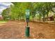 Designated pet area for residents with waste bags and disposal station within community grounds at 2160 Dillard Xing, Tucker, GA 30084