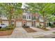 Attractive brick townhome featuring a one-car garage and well-manicured landscaping that enhances its curb appeal at 2160 Dillard Xing, Tucker, GA 30084