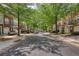 Charming townhomes line a tree-shaded street in a well-maintained community, offering a welcoming neighborhood feel at 2160 Dillard Xing, Tucker, GA 30084