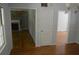 Bright living room showcasing hardwood floors and a fireplace with custom shelving on either side at 2381 Eastway Rd, Decatur, GA 30033