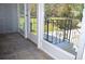 Enclosed porch with tile flooring offers a view of the landscaped yard at 2381 Eastway Rd, Decatur, GA 30033