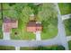 Aerial view of home showcasing its landscaping, roof, and proximity to the road at 3099 Regency Park Dr, Lithonia, GA 30038