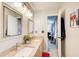 Bathroom with granite double vanity and decorative mirror at 3099 Regency Park Dr, Lithonia, GA 30038