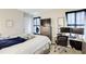 Bright bedroom featuring a work area, desk, and comfortable bedding at 3099 Regency Park Dr, Lithonia, GA 30038