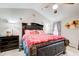 The bedroom has a decorative headboard, pink bedding, ceiling fan, and ornate accents at 3099 Regency Park Dr, Lithonia, GA 30038